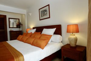 Villa Tropic 2 bedroom bed with decorative cushions